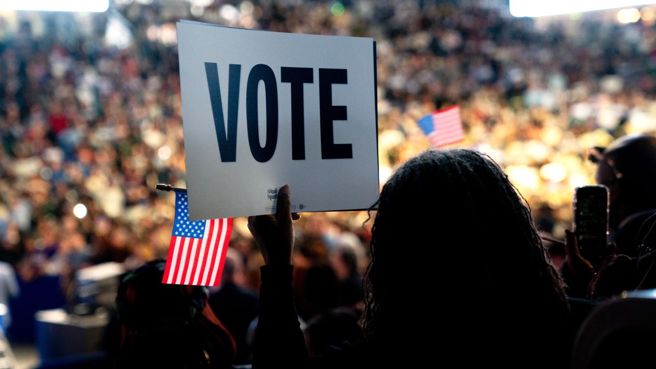 An attendee holds a "Vote" sign during a campaign event for former Rep. Abigail Spanberger, Democratic gubernatorial candidate for Virginia, in Norfolk on November 1.
