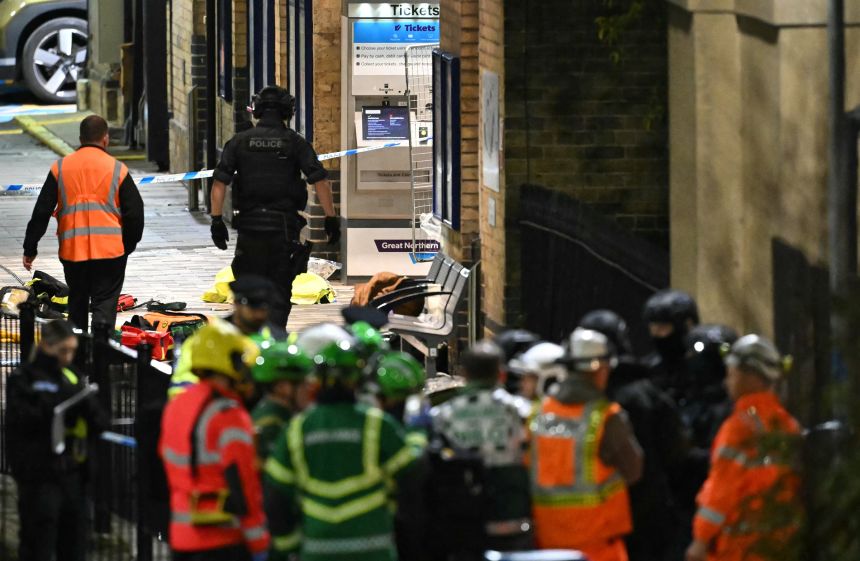 Emergency workers outside Huntingdon Station on Saturday evening.