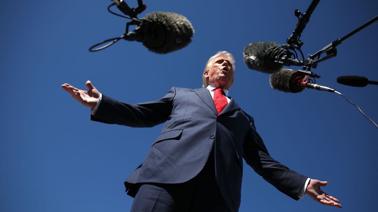 US President Donald Trump speaks to reporters as he arrives at Palm Beach International Airport on October 31, 2025 in West Palm Beach, Florida.