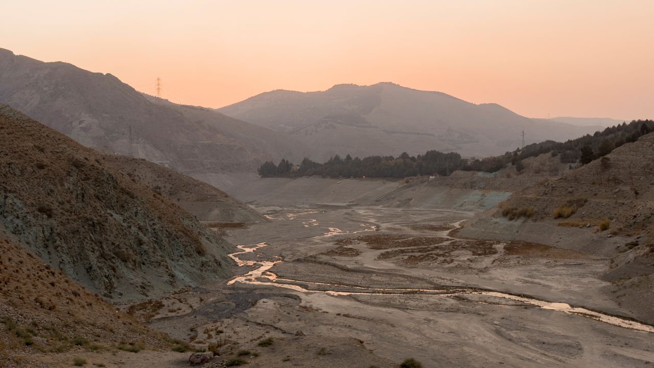 The receding waters of Latyan Dam reveal a dry riverbed near Tehran, Iran, on November 10, 2025. The reservoir, which supplies part of the capital's drinking water, has seen a sharp decline due to prolonged drought and rising demand in the Tehran region. (Photo by Bahram / Middle East Images via AFP) (Photo by BAHRAM/Middle East Images/AFP via Getty Images)          