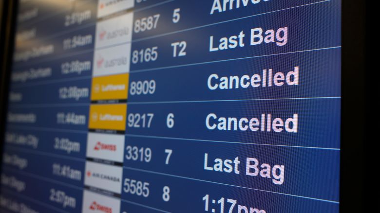 Cancelled flights are displayed on an arrivals board at San Francisco International Airport (SFO) on November 07, 2025 in San Francisco, California.