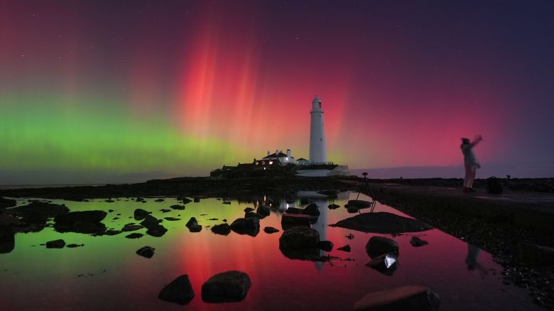 The aurora borealis, also known as the northern lights, glow in the sky over St Mary's Lighthouse in Whitley Bay on the North East coast, reaching a G4 level geomagnetic storm, putting on an amazing display in the early hours on November 12, 2025.
