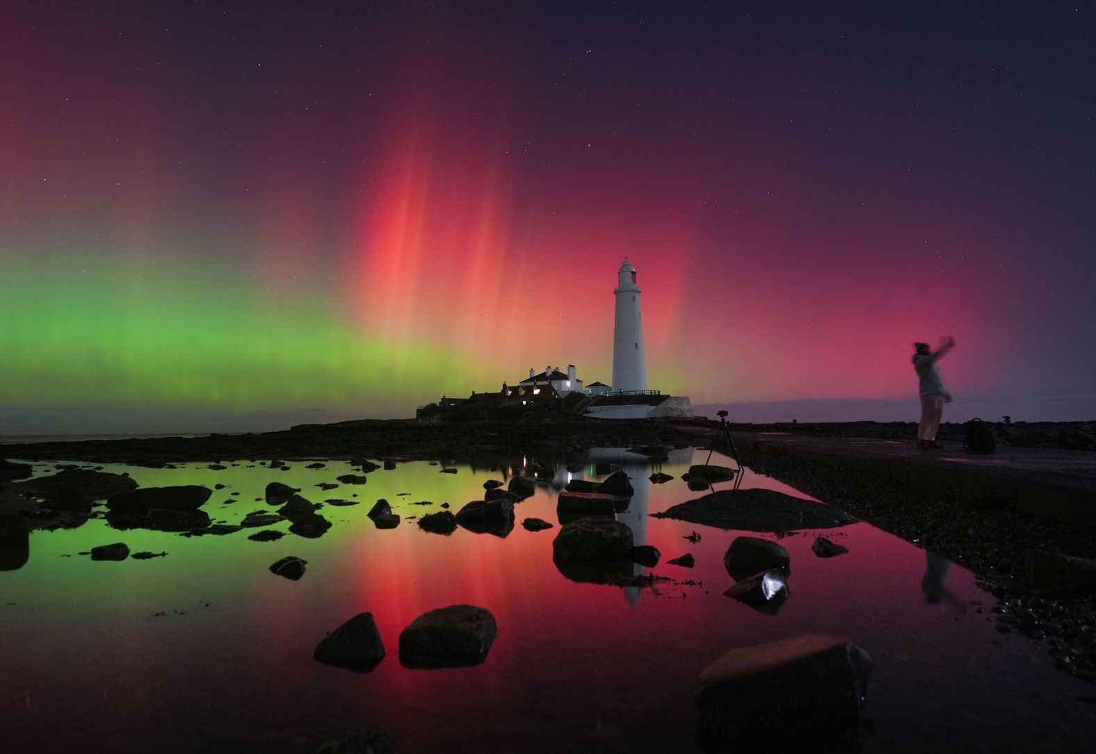 The northern lights glow over St. Mary’s Lighthouse in Whitley Bay, England, on Wednesday, November 12. Solar storms created a <a href="index.php?page=&url=https%3A%2F%2Fwww.cnn.com%2F2025%2F11%2F12%2Fscience%2Fgallery%2Faurora-borealis-solar-storm-111225">dazzling display of auroras</a> this week across regions where they are rarely witnessed.
