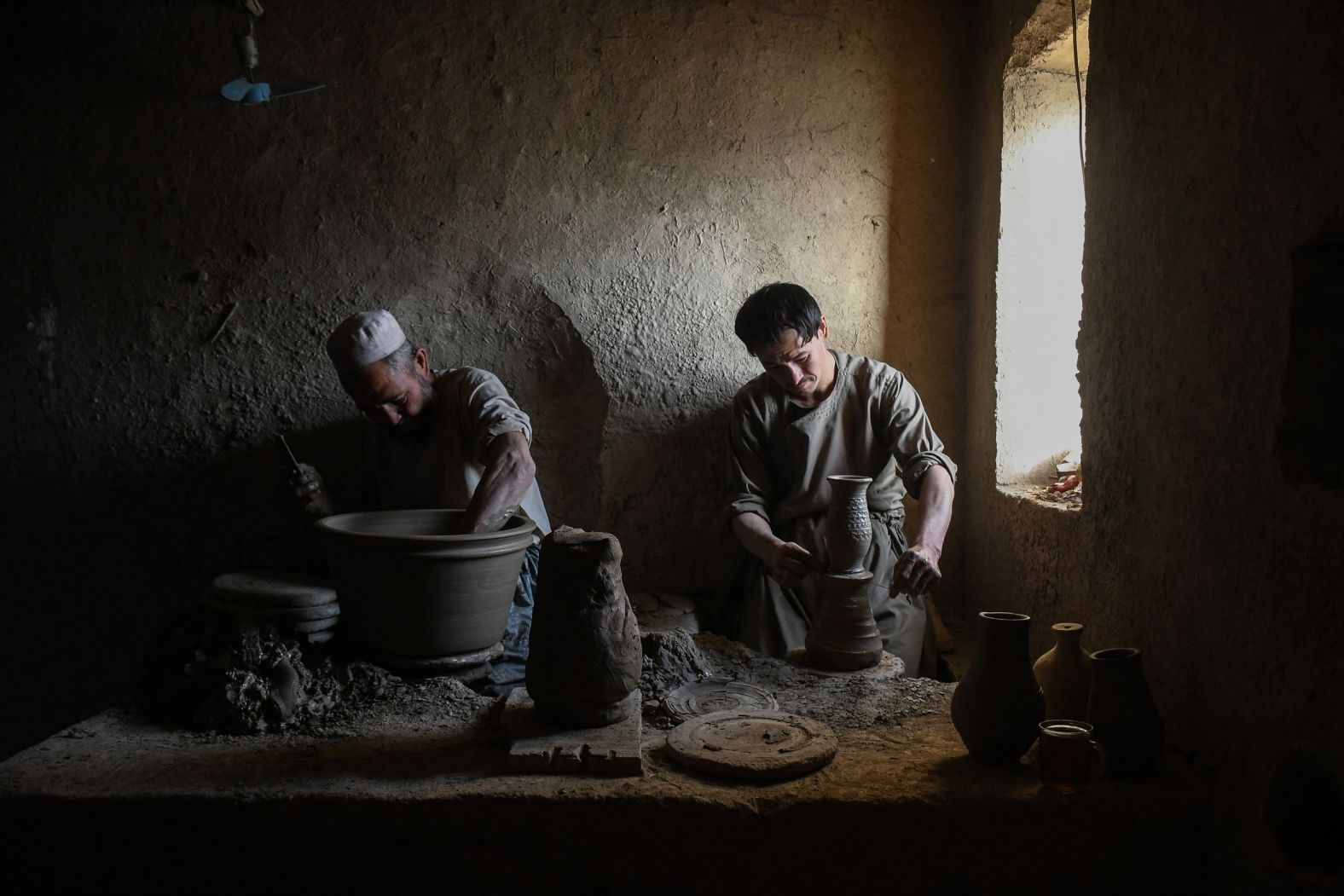 Men make clay pots at a pottery workshop in the Dawlatabad district of Afghanistan’s Balkh province on Thursday, November 13.