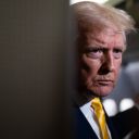 US President Donald Trump speaks to members of press aboard Air Force One on November 14, 2025 while in flight from Washington, DC to West Palm Beach International Airport.
