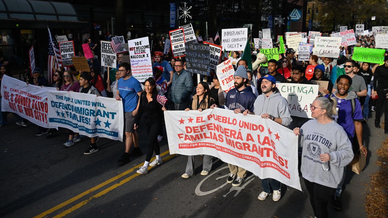 Protesters gather at First Ward Park for the 'No Border Patrol In Charlotte' rally to raise their voices for the immigrant community and against ICE raids and Border Patrol activity in Charlotte, North Carolina, US on November 15, 2025.