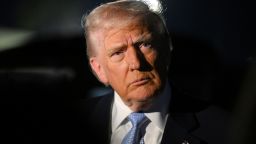 President Donald Trump speaks to reporters before boarding Air Force One on November 16.