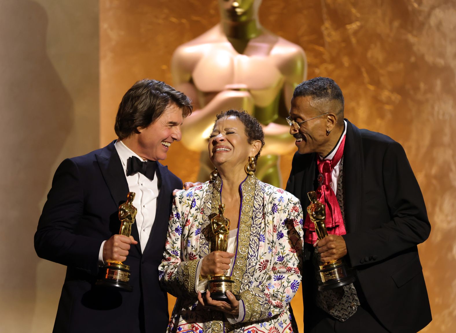 From left, actor Tom Cruise, actress and choreographer Debbie Allen and production designer Wynn Thomas hold the <a href="index.php?page=&url=https%3A%2F%2Fwww.cnn.com%2F2025%2F11%2F18%2Fentertainment%2Fvideo%2Fentertainment-showbiz-hollywood-minute-honorary-oscars-cruise-allen-thomas-parton-vanguard-stenbeck-viaplay">honorary Academy Awards</a> they received at the Governor Awards in Hollywood on Sunday, November 16. They were recognized for their contributions to cinema over the years.