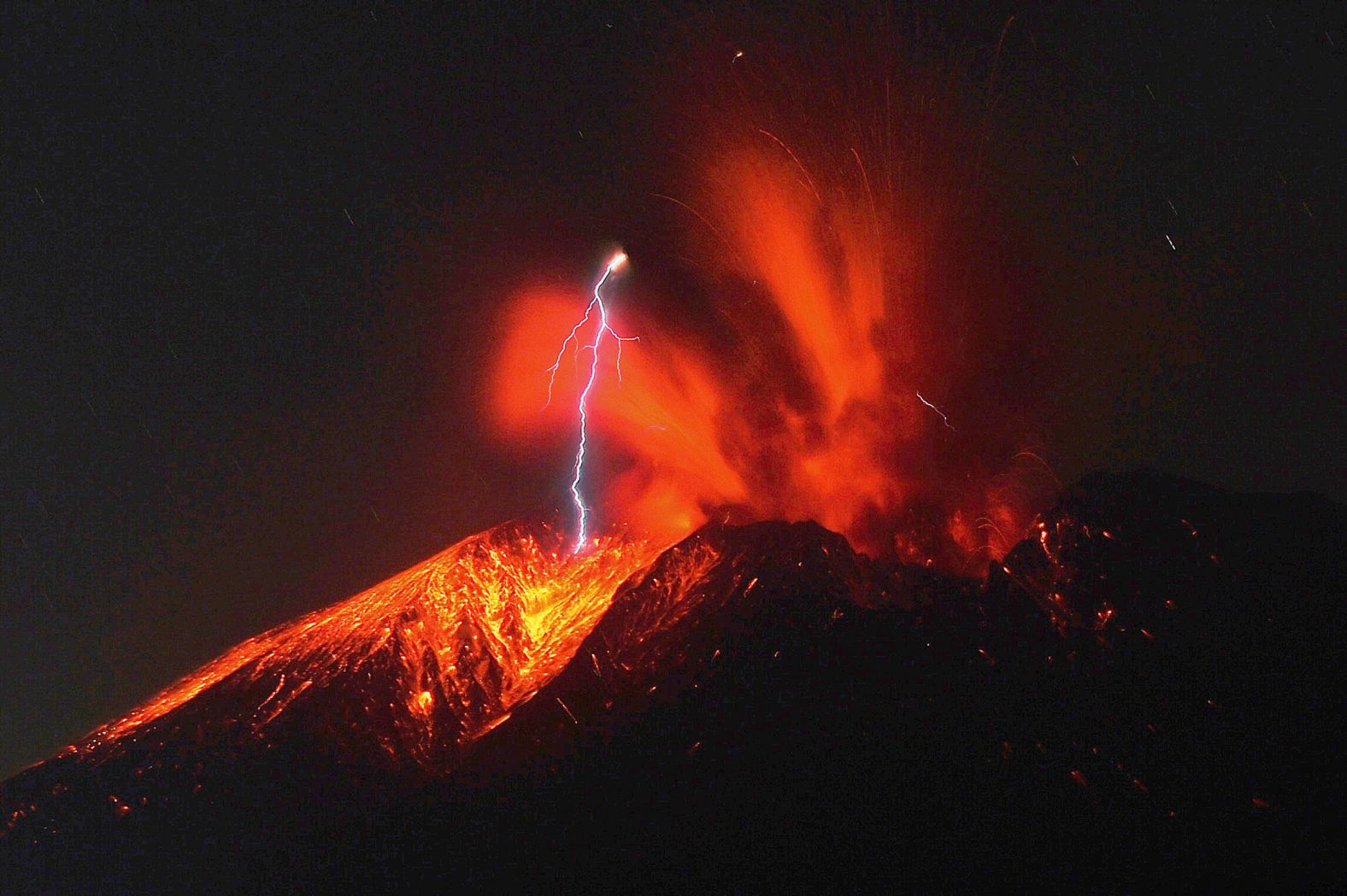 Lightning strikes over the Sakurajima volcano as it erupts in Tarumizu, Japan, on Sunday, November 16.