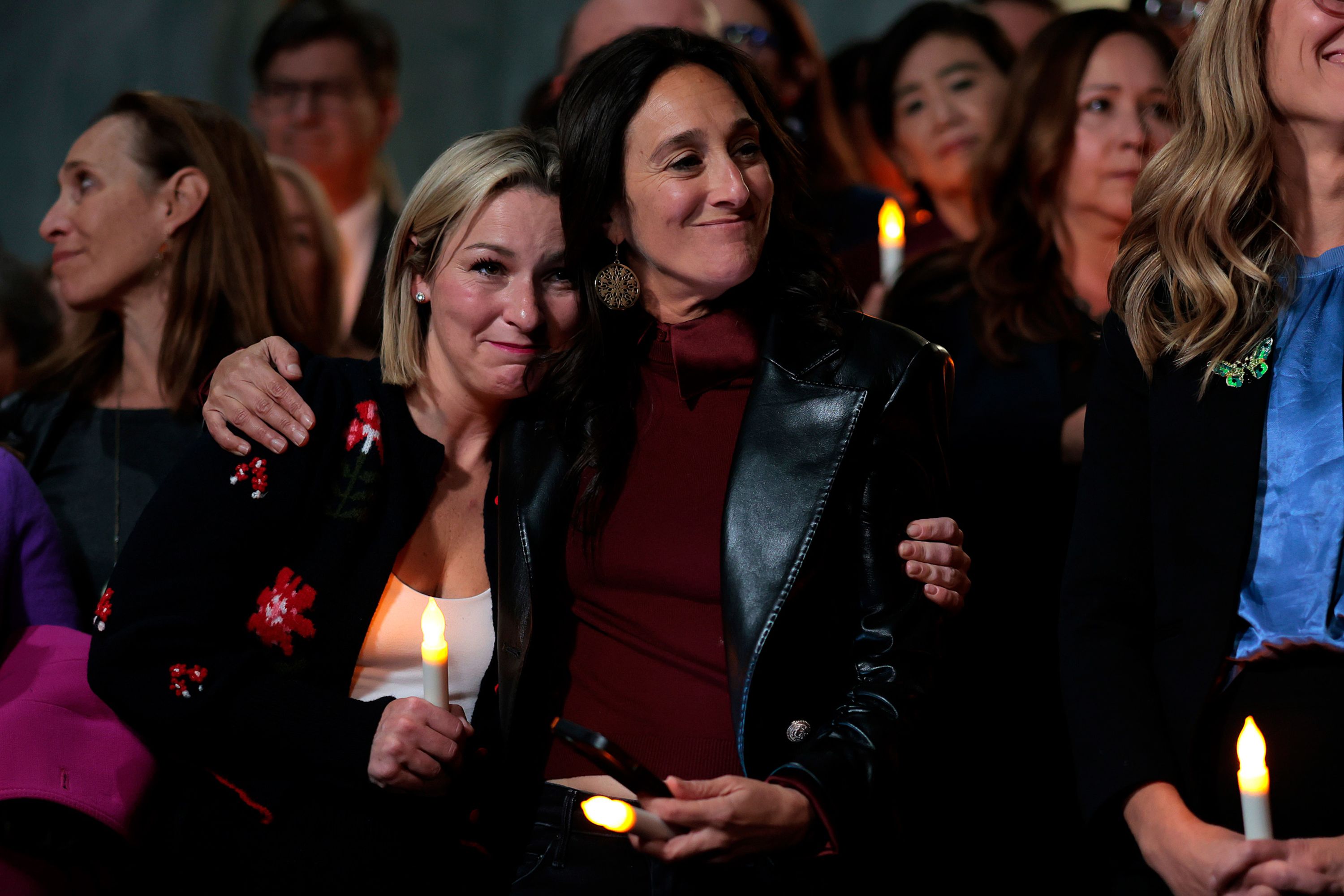 Jeffrey Epstein abuse survivor Danielle Bensky, left, and Lauren Hersh, the national director of the coalition World Without Exploitation, embrace each other in Washington, DC, after learning that the US Senate had agreed to pass the Epstein files legislation on Tuesday, November 18.