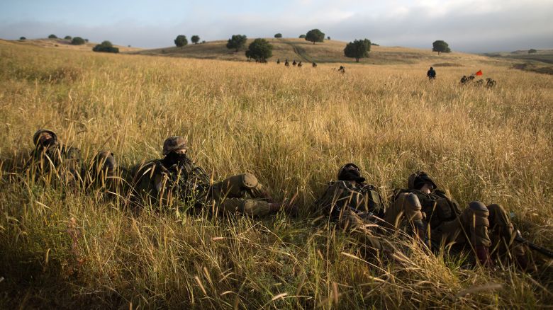 In this 2014 photo, Israeli soldiers of the Ultra-Orthodox Netzah Yehuda battalion take part in their annual unit training in the Israeli annexed Golan Heights, near the Syrian border.
