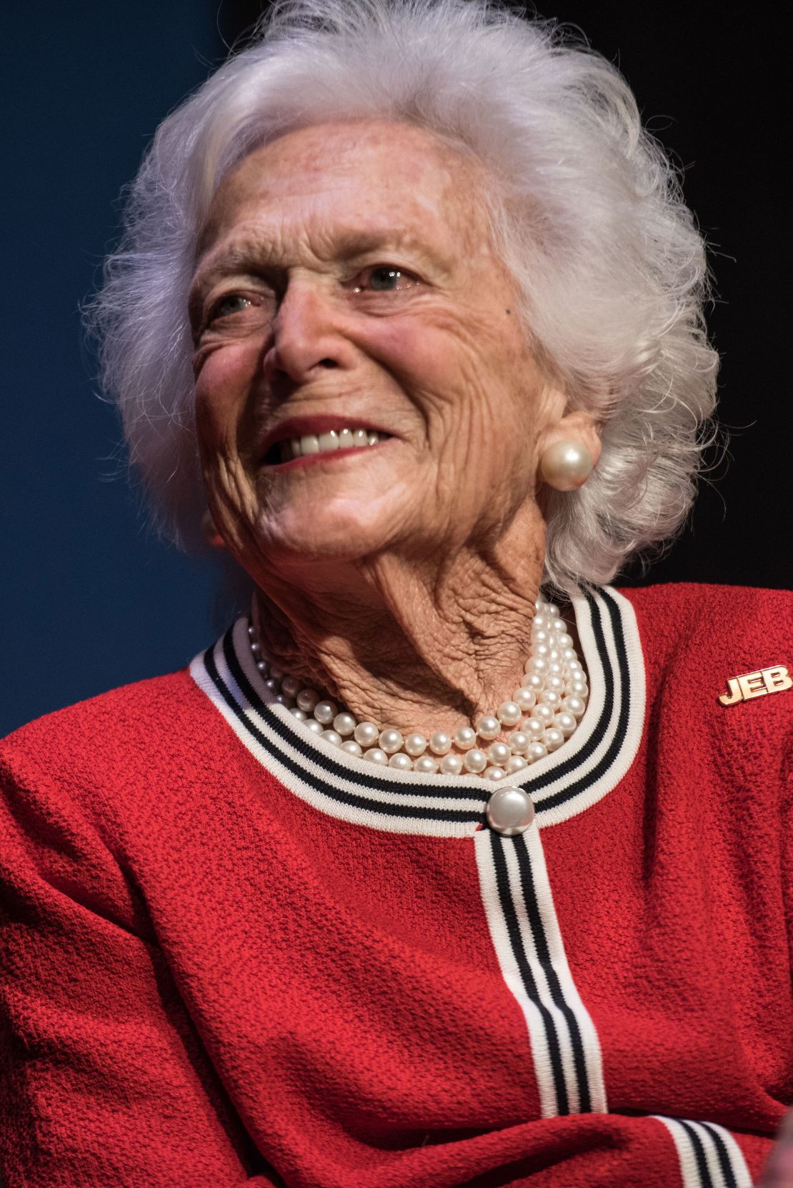 Former first lady Barbara Bush listens to her son Jeb Bush at a campaign event February 19, 2016 in Greenville, South Carolina.