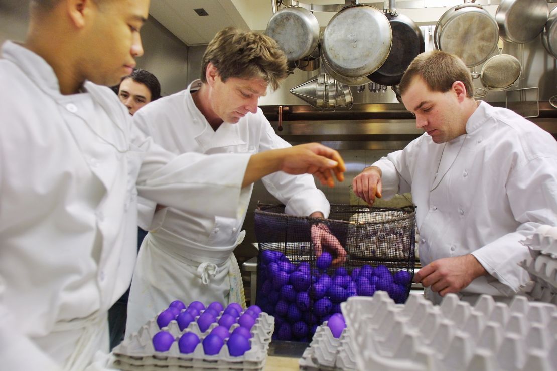 In this 2002 photo, White House kitchen staff transfer boiled, dyed eggs in Washington, DC.