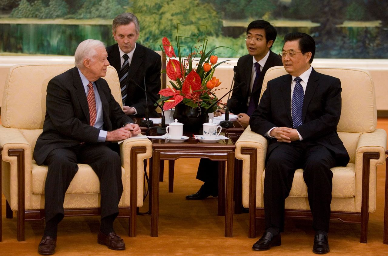 Chinese President Hu Jintao, right, speaks with former US President James Carter, right during a meeting at the Great Hall of the People on January 12, 2009 in Beijing, China. Carter visited Beijing to celebrate the 30th anniversary of the establishment of US-China diplomatic relations.