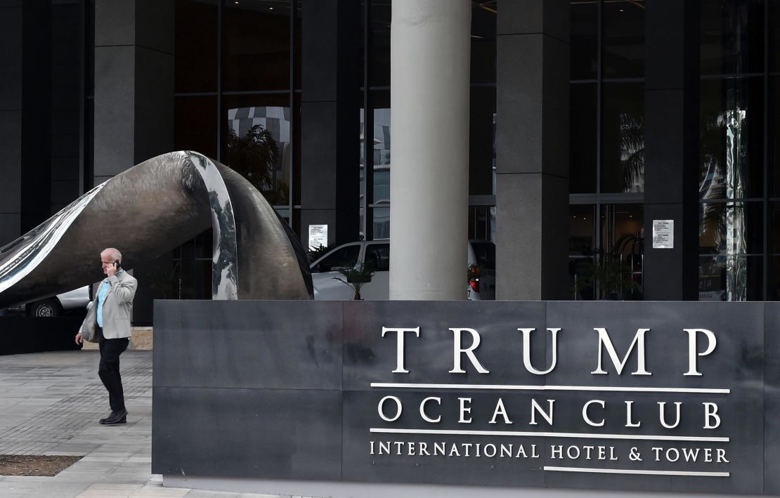 A man walks next to the Trump Ocean Club International Hotel in Panama City on February 27, 2018. 