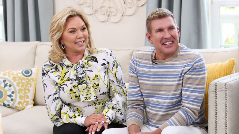 In this 2018 photo, reality TV Personalities Julie Chrisley, left, and and Todd Chrisley visit Universal Studios Hollywood in Universal City, California. 