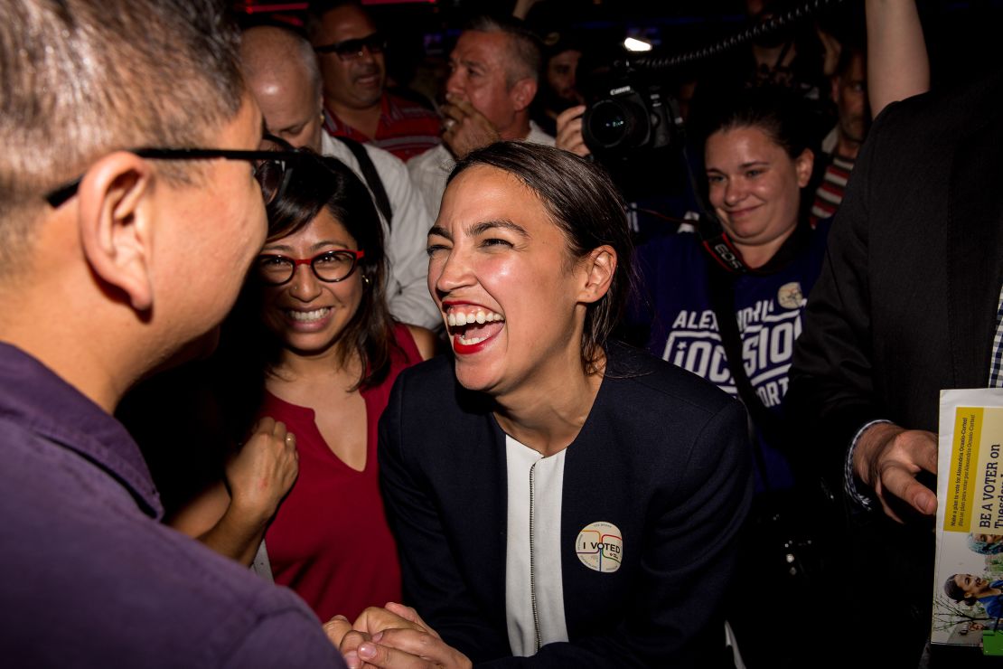 This June 2018 photo shows Alexandria Ocasio-Cortez celebrating with supporters at a victory party in the Bronx after upsetting incumbent Democratic Rep. Joseph Crowly in New York City.