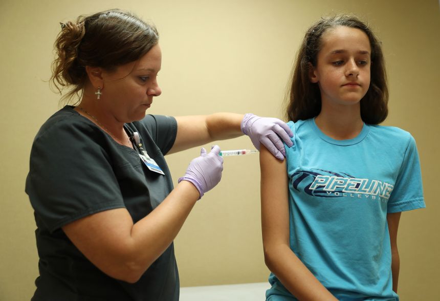 In this 2018 photo, a nurse administers a dose of the HPV vaccine to a 13-year-old in Hoffman Estates, Illinois.