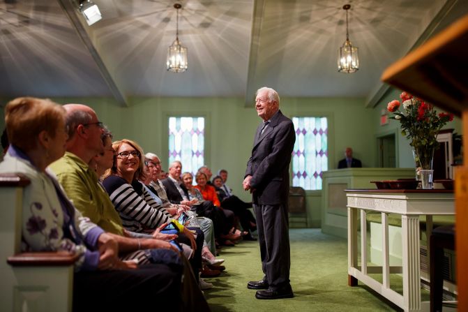 Former President Jimmy Carter greets visitors before teaching a Sunday school class at Maranatha Baptist Church in Plains, Ga., April 15, 2018. 