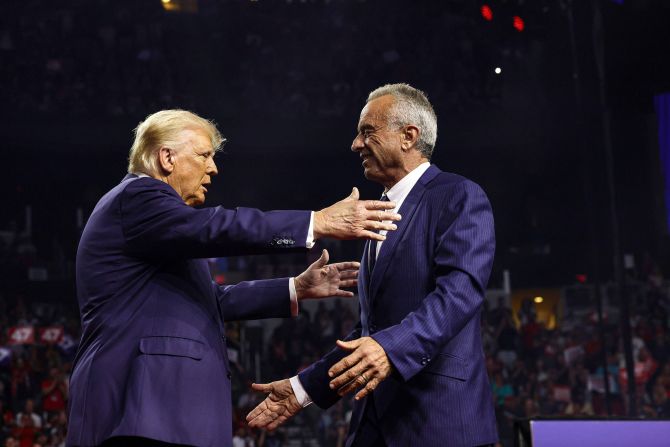 Former President Donald Trump, left, greets Robert F. Kennedy Jr., at a campaign rally in Glendale, Arizona, on August 23. Kennedy had just suspended his independent campaign and <a >threw his support behind Trump</a>.