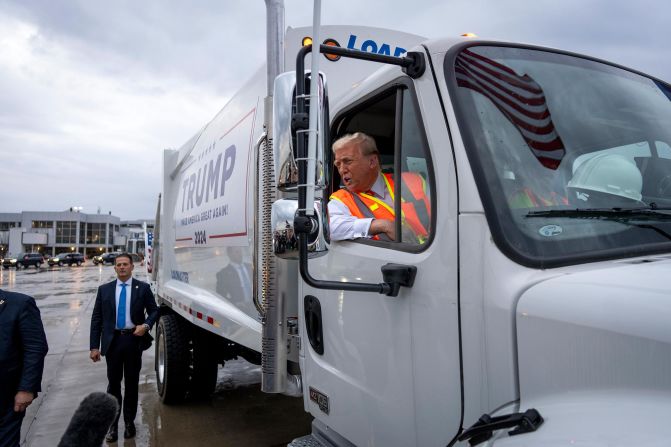 Trump speaks from a garbage truck in Green Bay, Wisconsin, in October 2024. <a href="index.php?page=&url=https%3A%2F%2Fwww.cnn.com%2F2024%2F10%2F31%2Fpolitics%2Fgarbage-truck-donald-trump-wisconsin%2Findex.html">Trump was seizing on a garbled remark by Biden</a> that seemed to insult Trump voters as “garbage.” Biden has personally denied calling Trump supporters “garbage,” saying his comment on a video call was misinterpreted. The White House, on cleanup duty, insisted the president was only talking about one person, the comedian who called Puerto Rico a “floating island of garbage” during the Trump rally at Madison Square Garden.