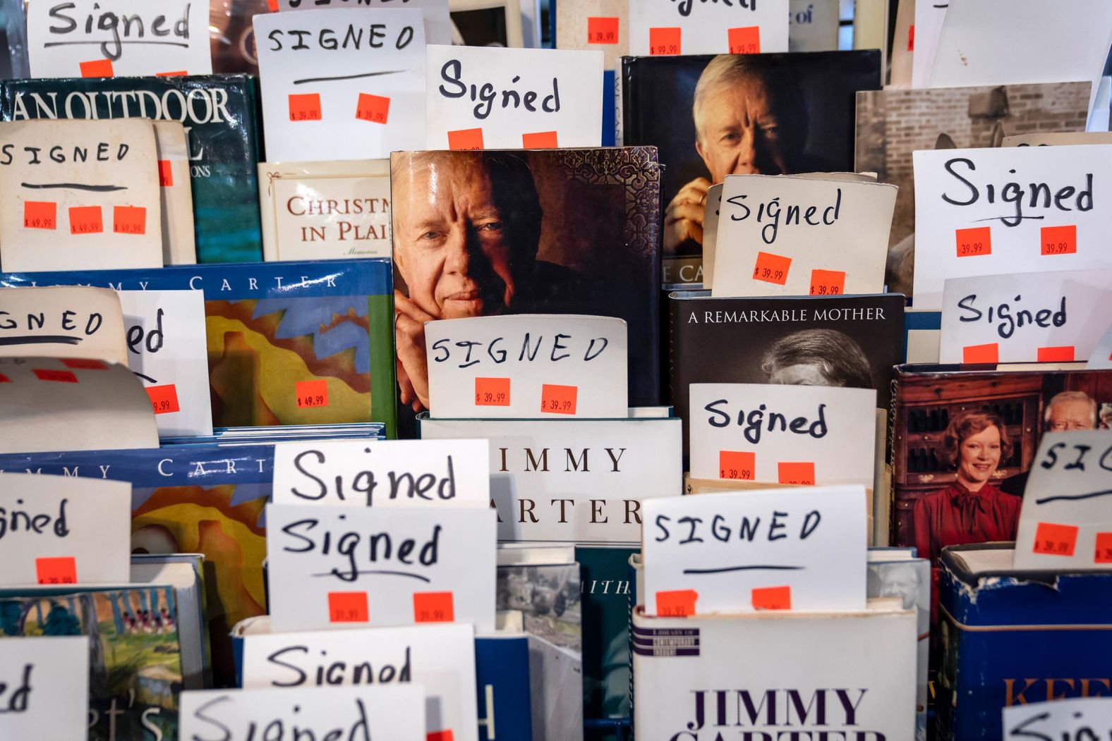 Books signed by Carter are up for sale at the Plains Trading Post on December 30.