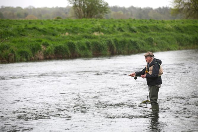 Carter fly fishes in Kilkenny, Ireland, in May 2013. 