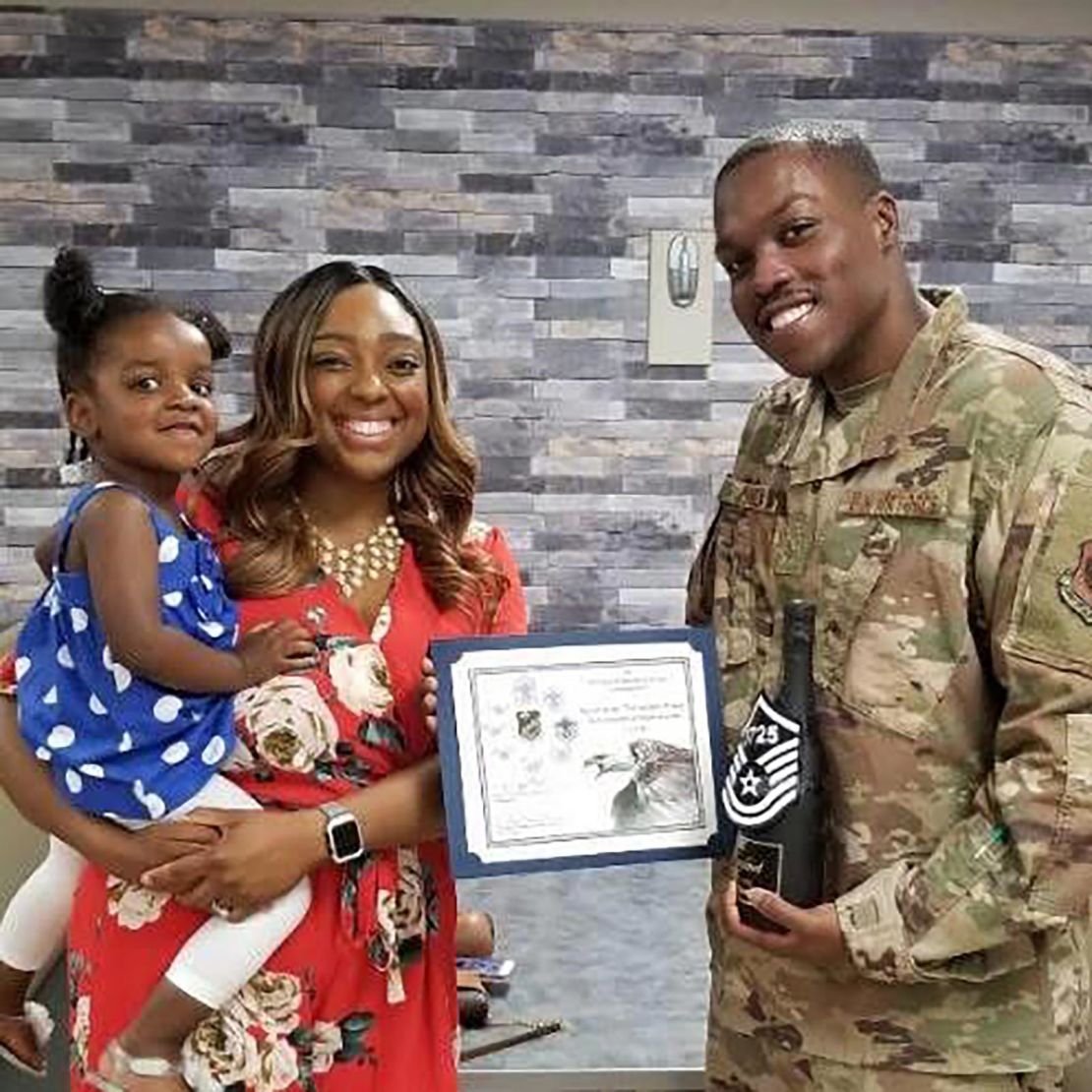 Arielle Pines, left, a former Department of Veterans Affairs employee, and her husband a senior enlisted airman in the Air Force and her daughter.