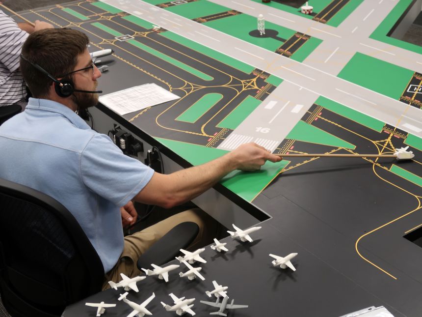 Learning to control planes using a table top model at the FAA Academy.