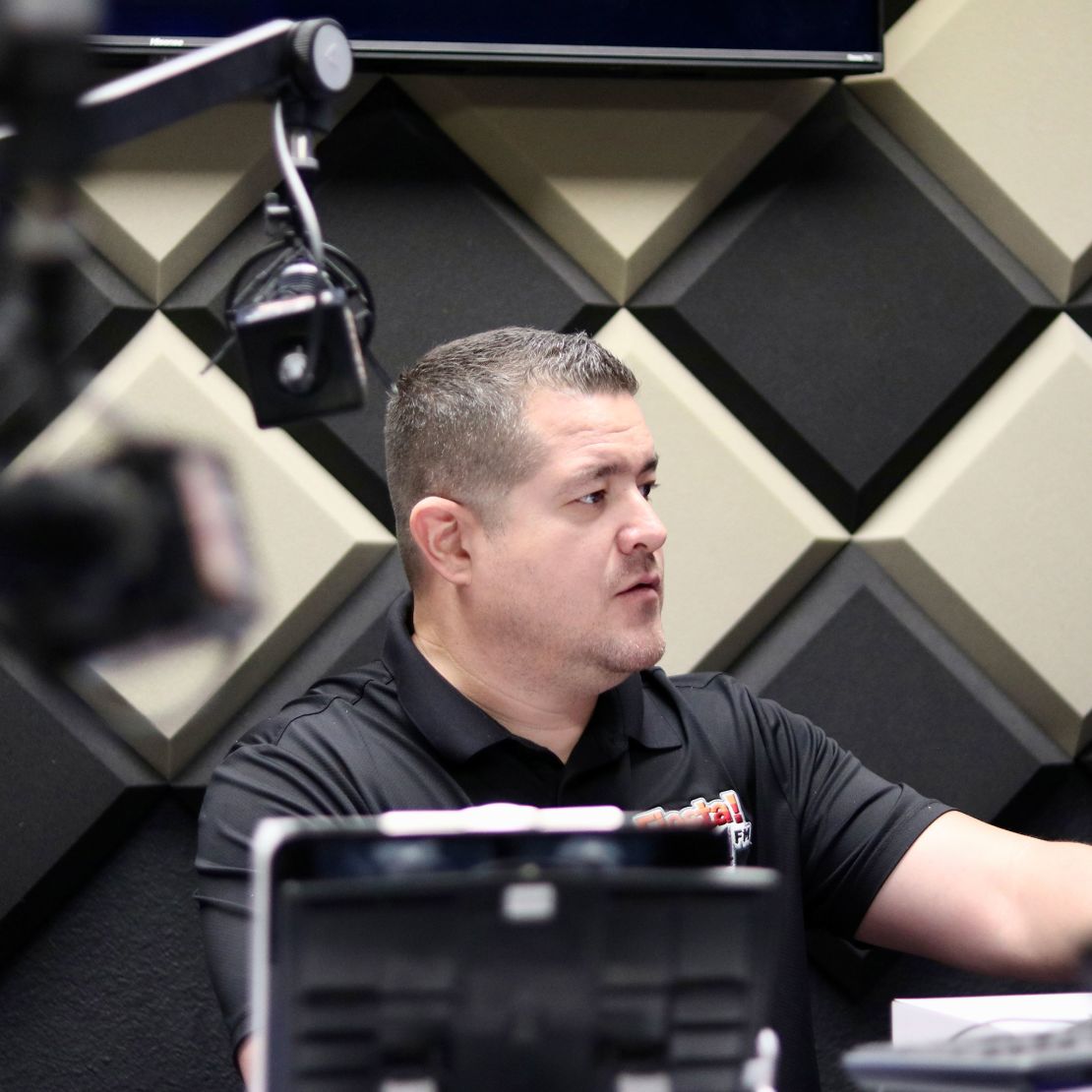 Fiesta 98.1 co-owner and radio personality Rogelio Regalado prepares to go on air.