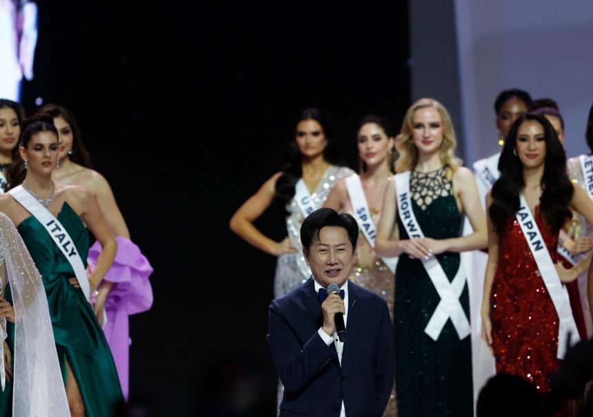 Nawat Itsaragrisil (center) National Director of Miss Universe Thailand 2025 speaks next to contestants during the official Miss Universe 2025 welcome event in Bangkok, Thailand, on November 5.