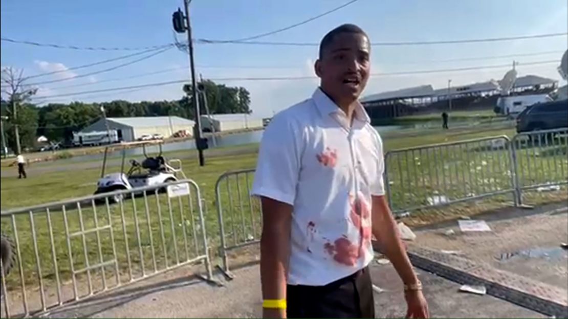 Rico Elmore speaks to CNN and described jumping over the barrier and putting his hand on the head of an attendee who was shot and bleeding.