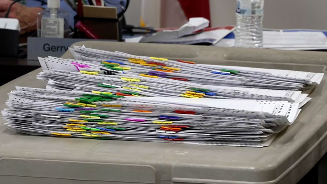 Mail-in ballots wait to be processed on a table at the Wake County Board of Elections in Raleigh, North Carolina.