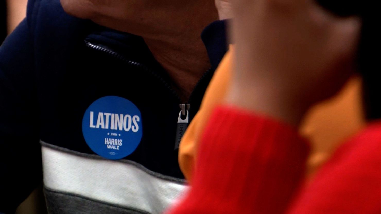 A person wears a "Latinos con Harris Walz" sticker in Pennsylvania.