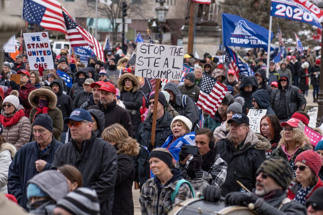 Supporters of then-President Donald Trump gather outside of Michigan’s State Capitol building in Lansing on Wednesday, January 6, 2021.