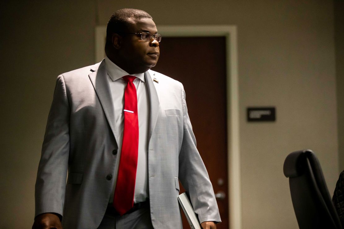 John Gibbs walks to his seat before a county's commissioners meeting in February 2023 in West Olive, Michigan.