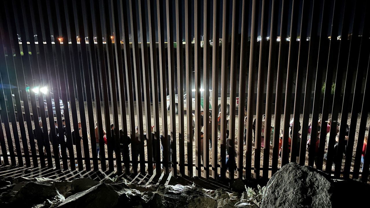 Border patrol agents interview and process a group of 30 migrants on June 3.
