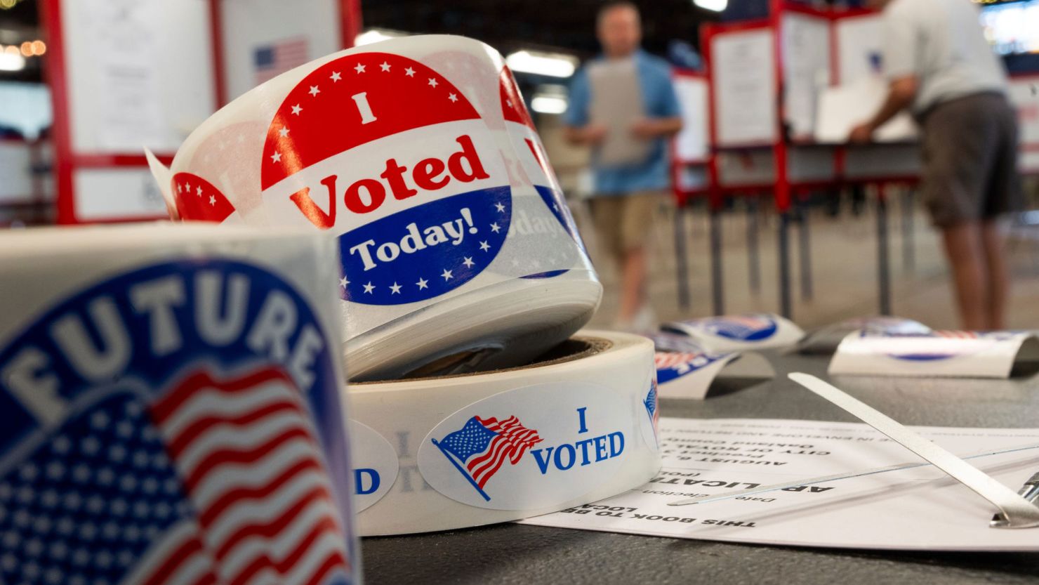 In this August 6 photo, people prepare to cast their ballots in Michigan.