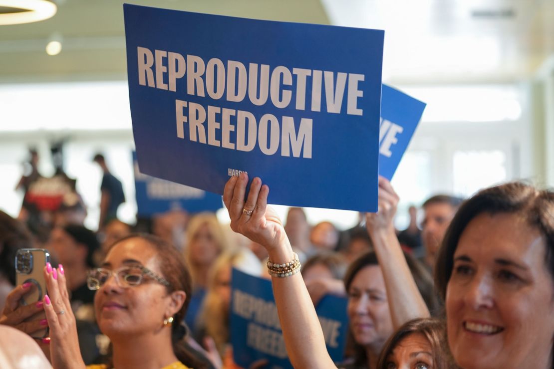 Fans hold Reproductive Freedom signs as Pennsylvania Gov. Josh Shapiro headlines a Harris-Walz Reproductive Freedom Bus Tour on Sunday, September 15.