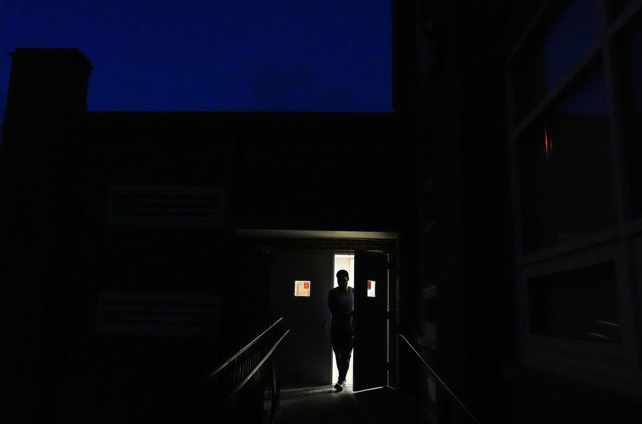 Voter Joseph Scott leaves the polling precinct shortly after 6 p.m. after arriving just before the polls closed at Shawnee High School in Louisville, Kentucky. 