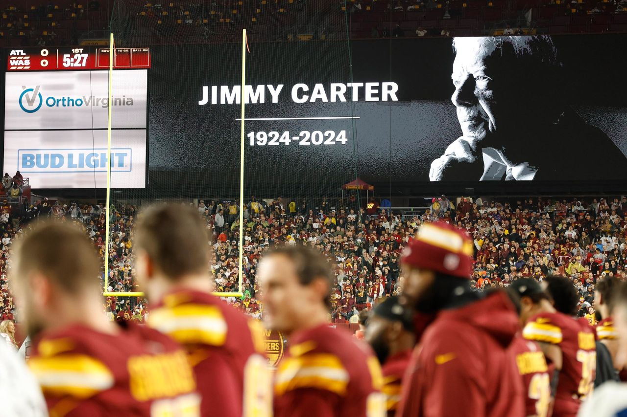 The Atlanta Falcons and the Washington Commanders observe a moment of silence for Carter prior to their game on Sunday at Northwest Stadium in Landover, Maryland.