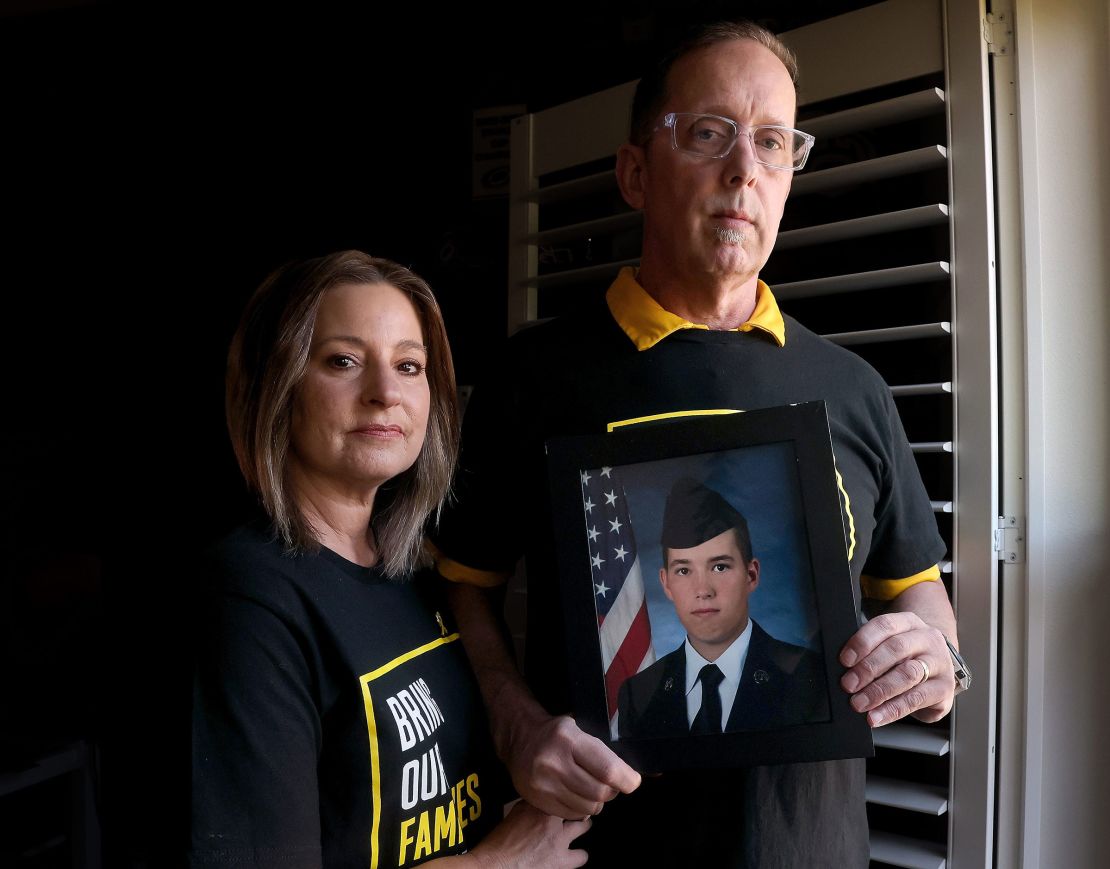Scott and Patti St. Clair hold a photo of their son Joseph at their home in Hansville, Washington, on May 6, 2025.