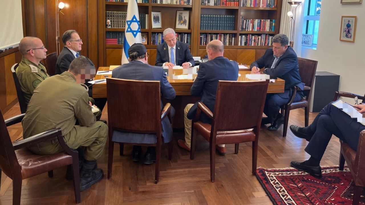 In this handout photo from the Israeli Prime Minister's Office, Prime Minister Benjamin Netanyahu and his advisers hold a phone call with US President Joe Biden on October 9.