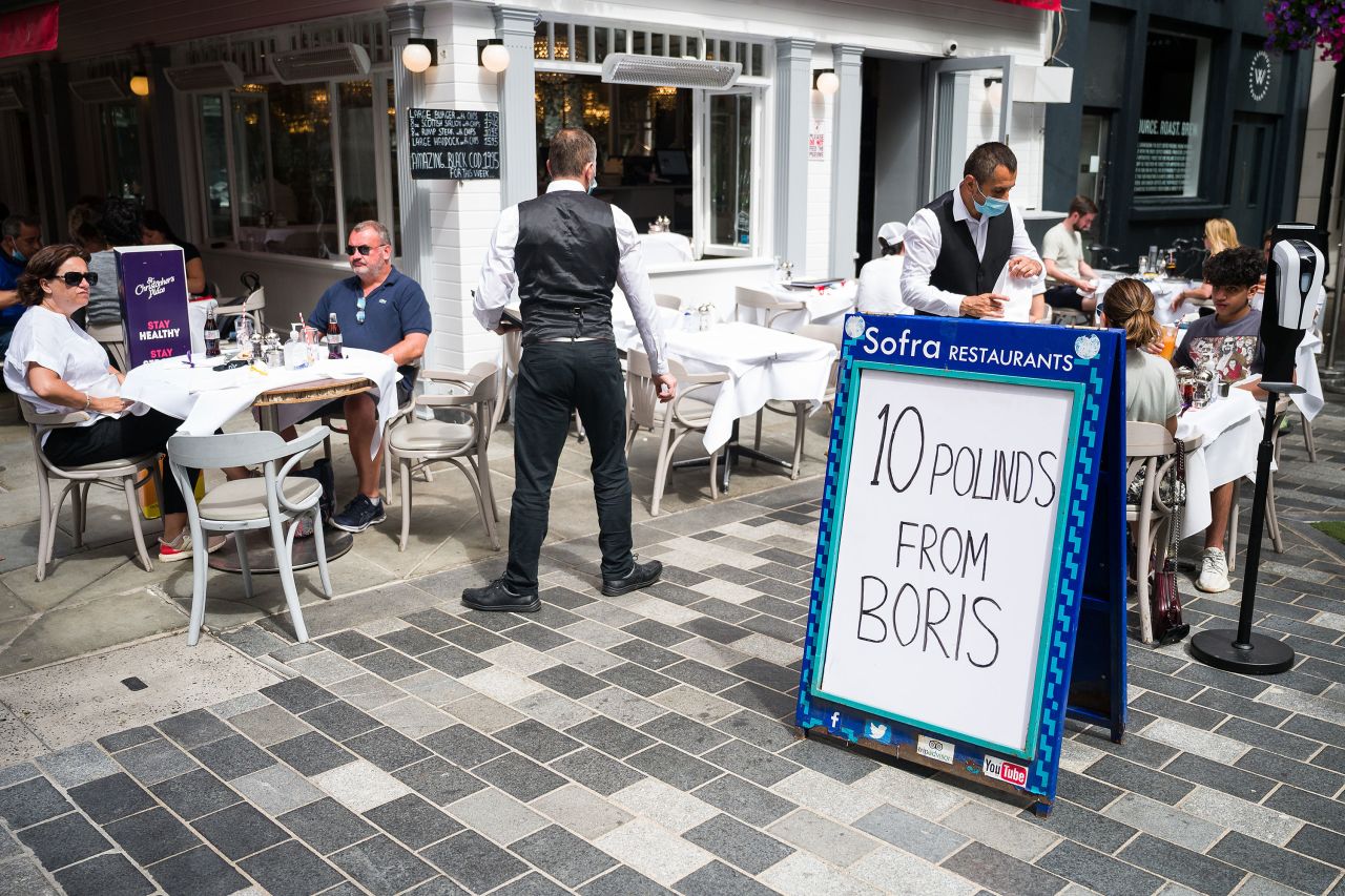 A sign advertises the "Eat Out to Help Out" discount at a restaurant in London on August 5.