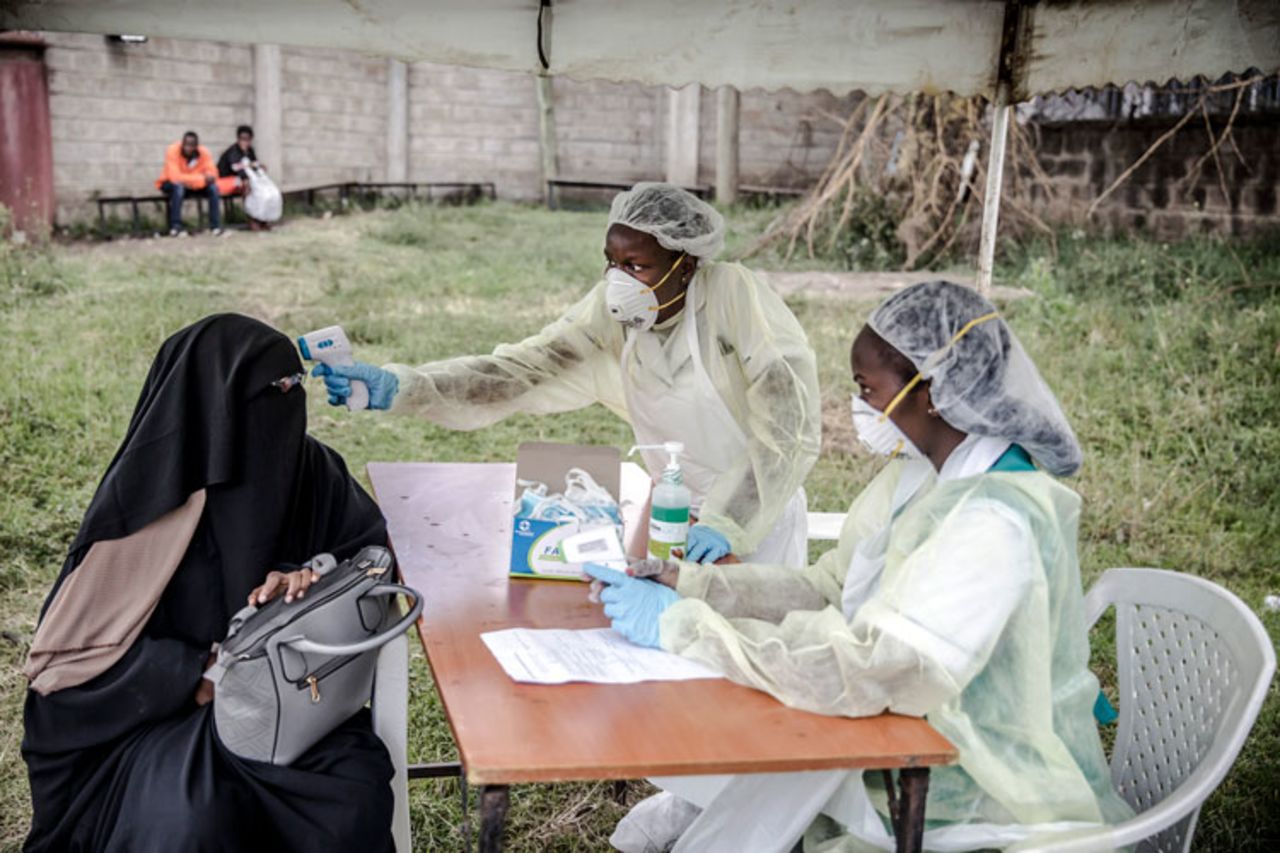 Health personnel measure the temperature of a visitor at the entrance of the Mbagathi Hospital in Nairobi, Kenya on March 18. 