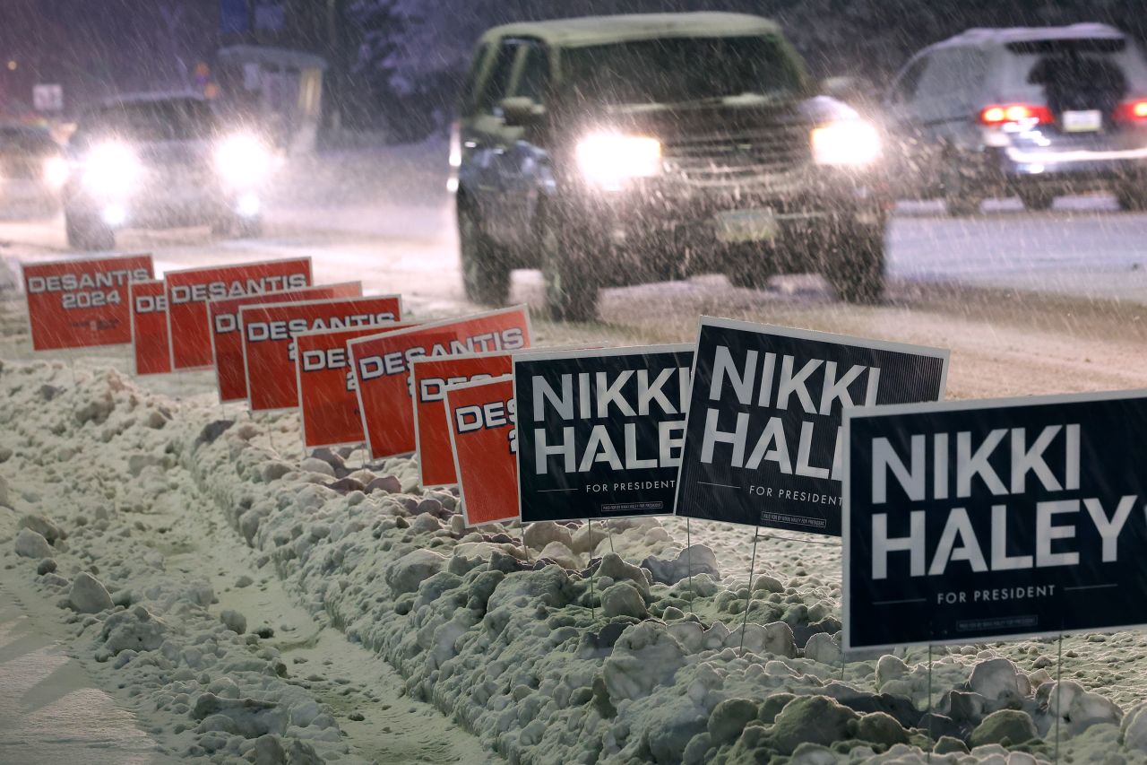 Campaign signs for Republican presidential candidates Nikki Haley and Ron Desantis line a road in front of Drake University in Des Moines, Iowa, on January 10.