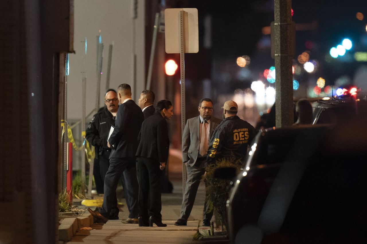 Investigators gather at a scene where a shooting took place in Monterey Park, California on Sunday.