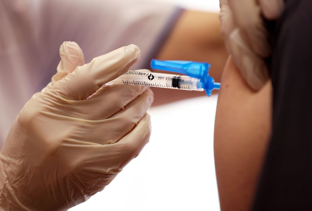 A dose of the Moderna Covid-19 vaccine is administered to a staff member at the Ararat Nursing Facility in the Mission Hills neighborhood of Los Angeles on January 7, in Los Angeles.