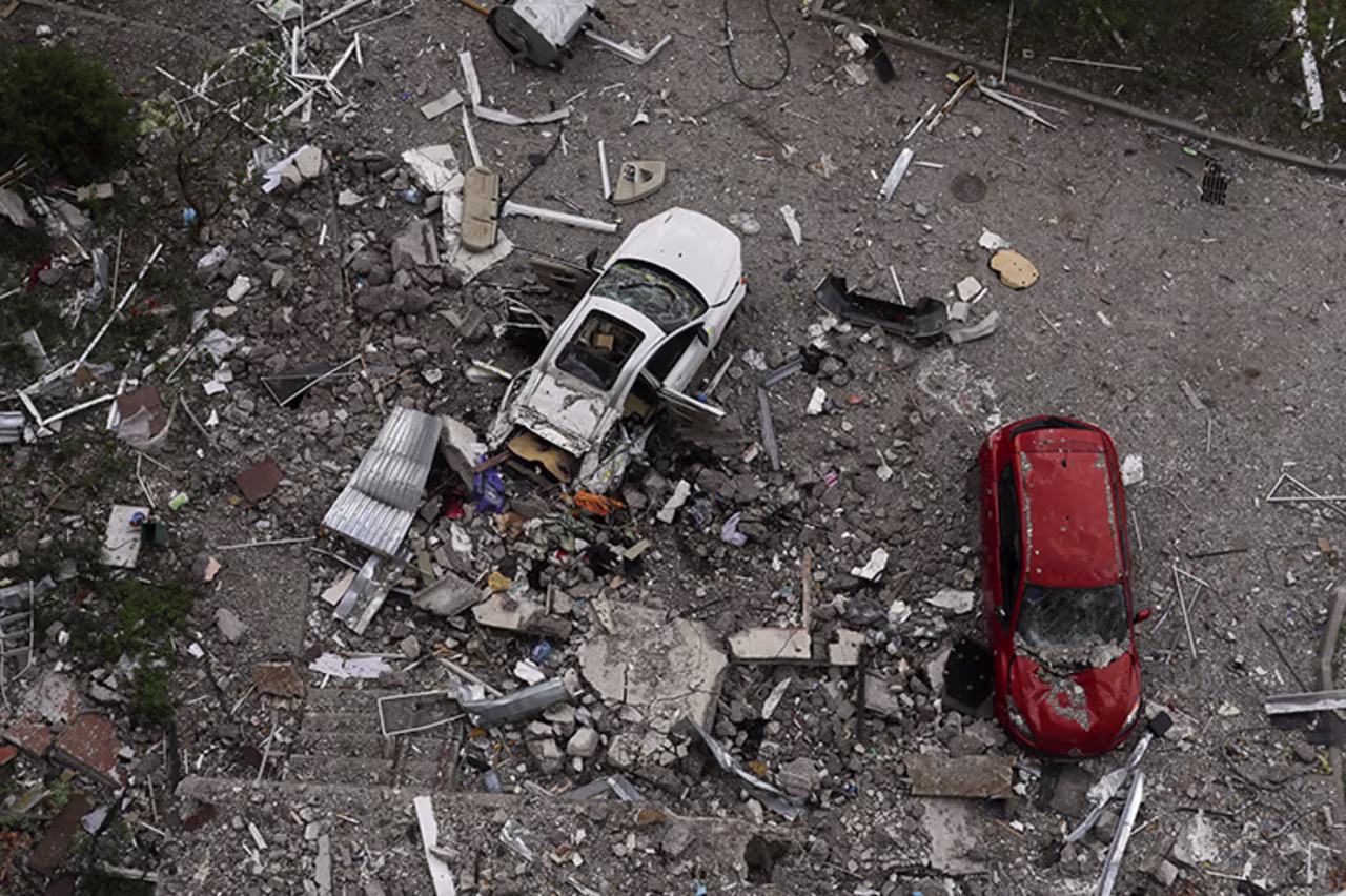 Damaged cars and debris from a damaged residential building are seen in the  Saltivka neighbourhood, of  Kharkiv, Ukraine, on Tuesday May 10. 