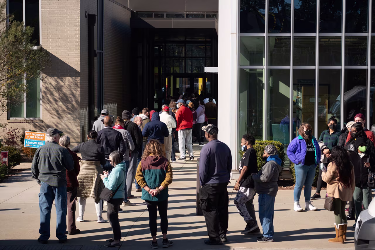 Voters line up at Metropolitan Library to cast their ballots in the runoff election in Atlanta on November 29. 